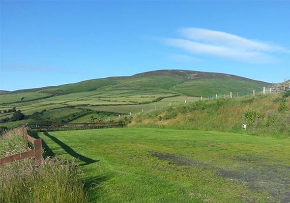 Terraced hard standings for campervans & caravans, looking North towards the hill Slieau Freoaghane.